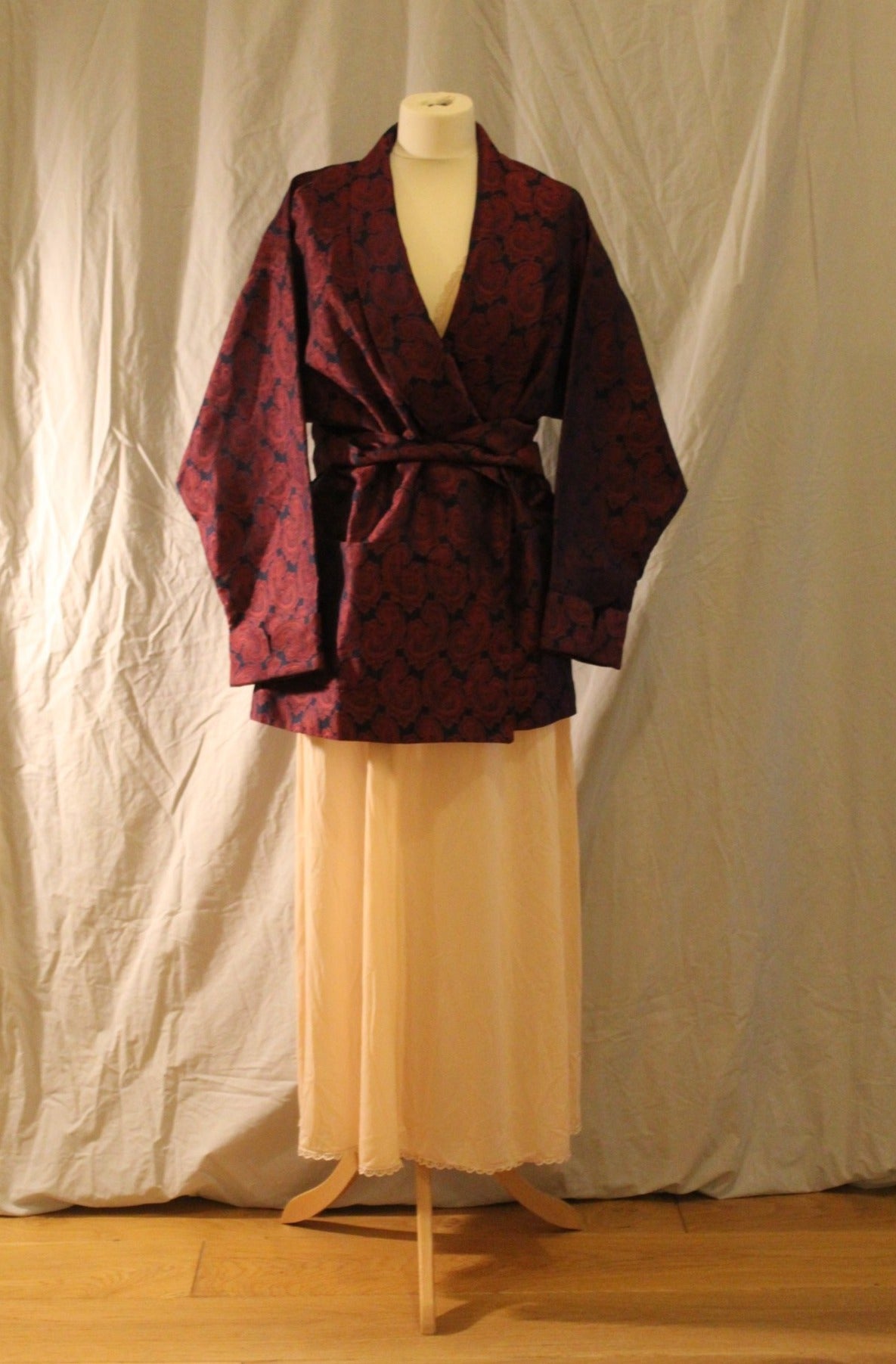 Structured black smoking jacket robe with wine paisley