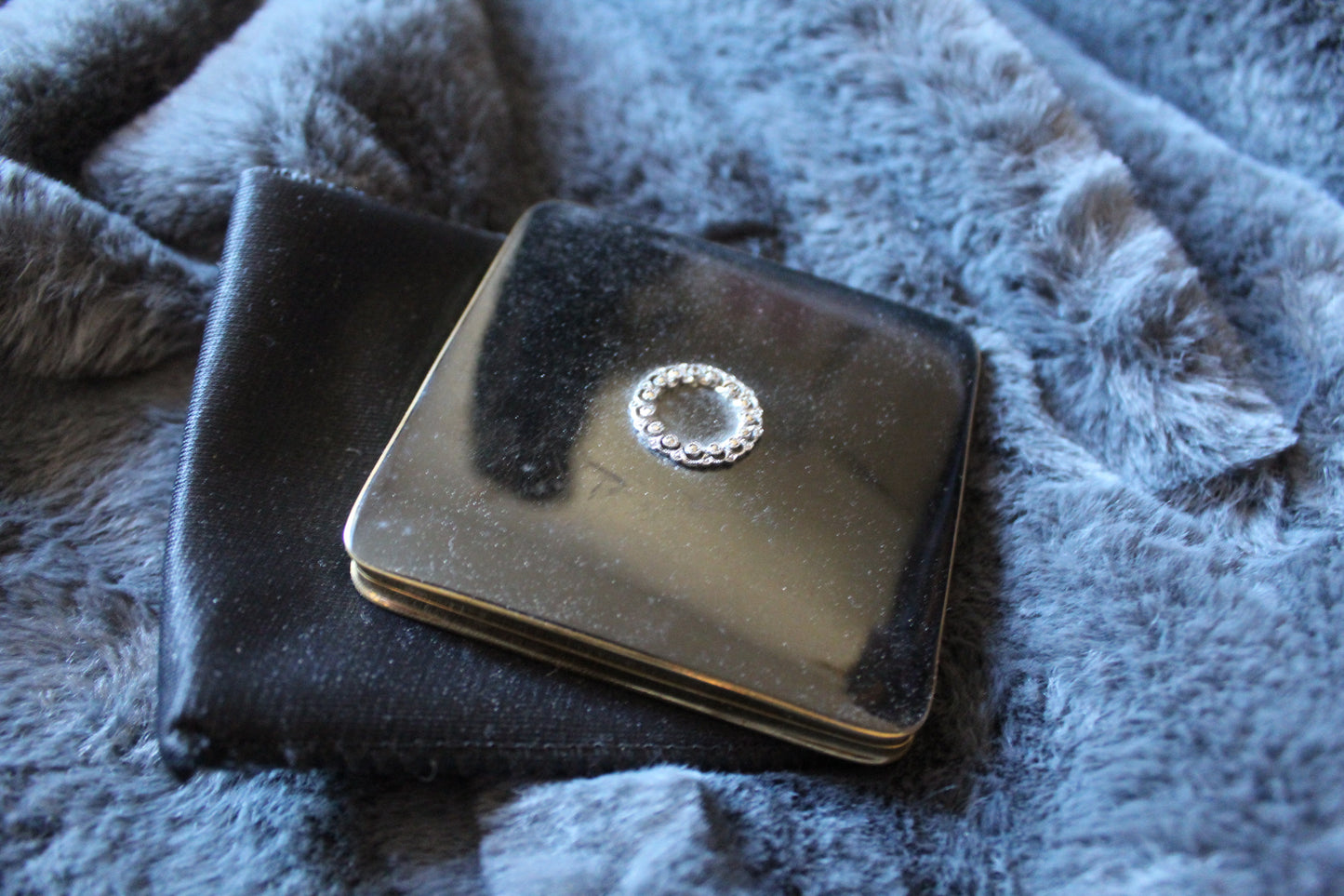 Black vintage compact with stone design