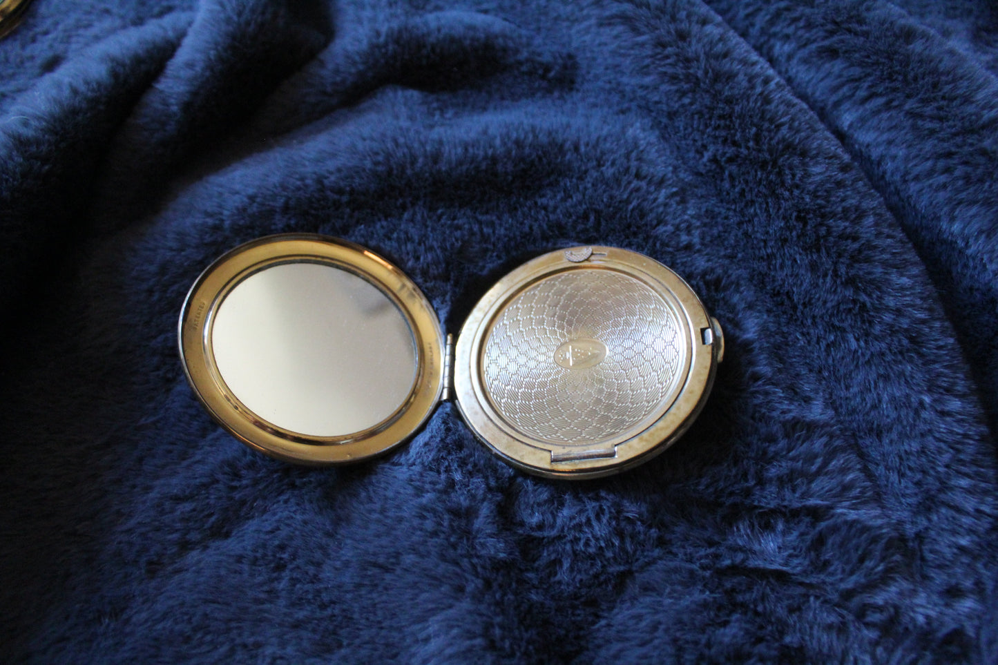 Vintage compact with butterfly illustration