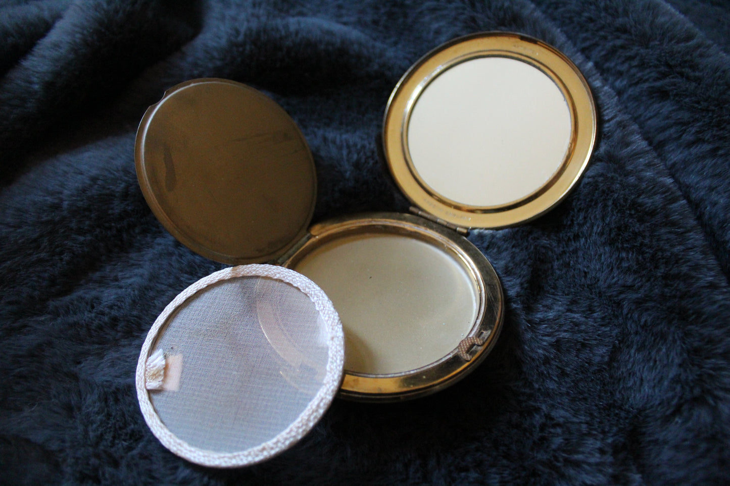 Vintage compact with butterfly illustration