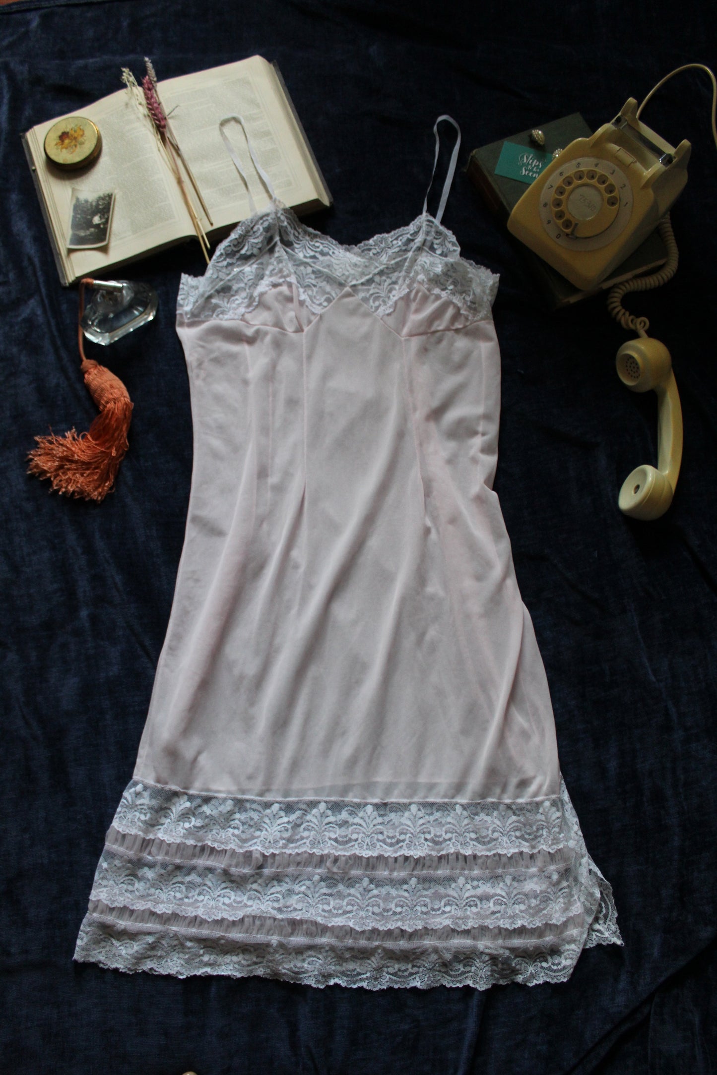Delicate pastel peach slip with white lace