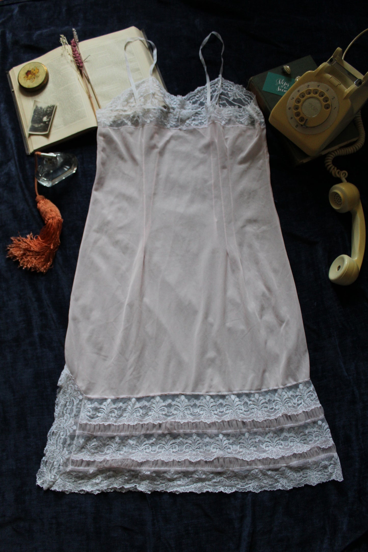 Delicate pastel peach slip with white lace