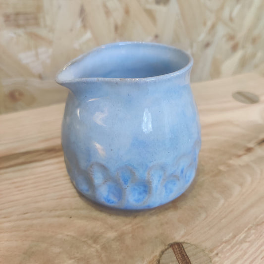 Blue milk jug with grooves