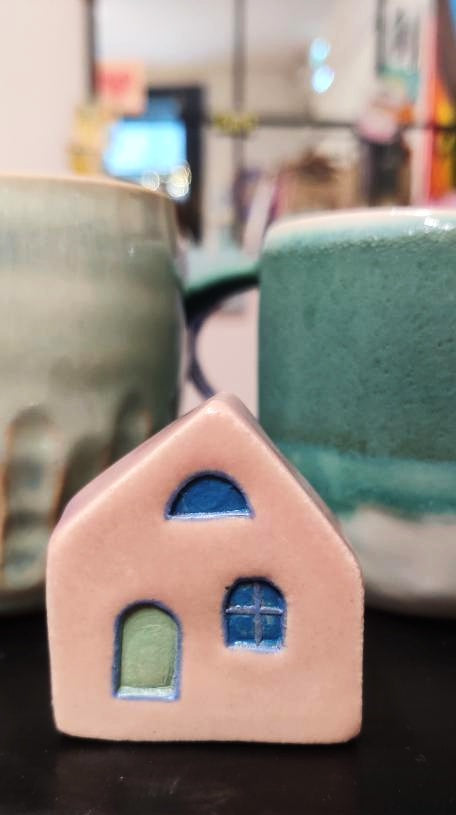 Pink Ceramic House With blue doors