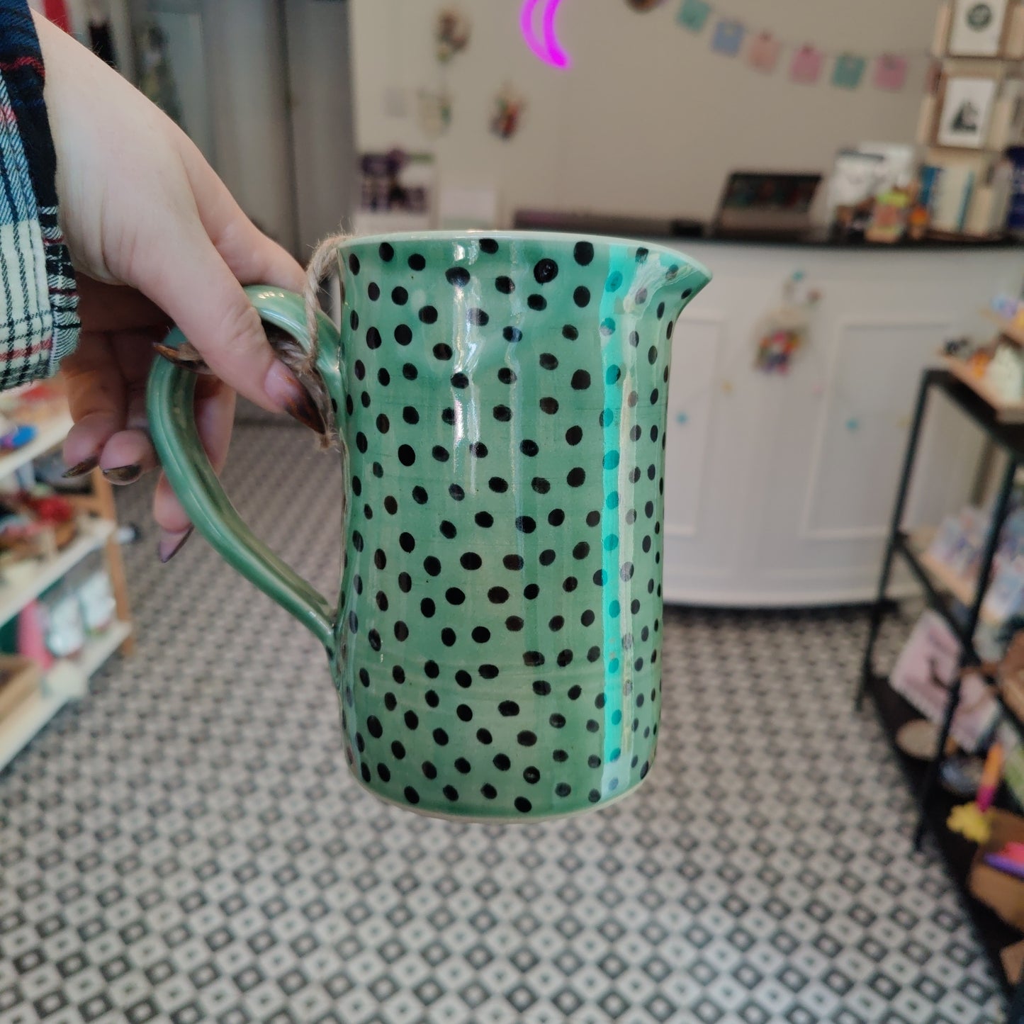 Large emerald jug with black dots