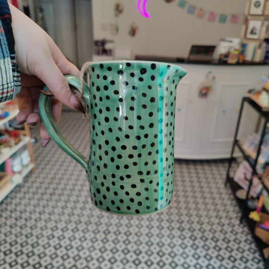 Large emerald jug with black dots