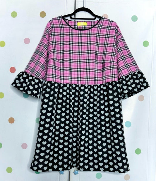 Pink and black check dress with white hearts