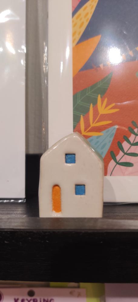 Pink Ceramic House With Orange and Blue