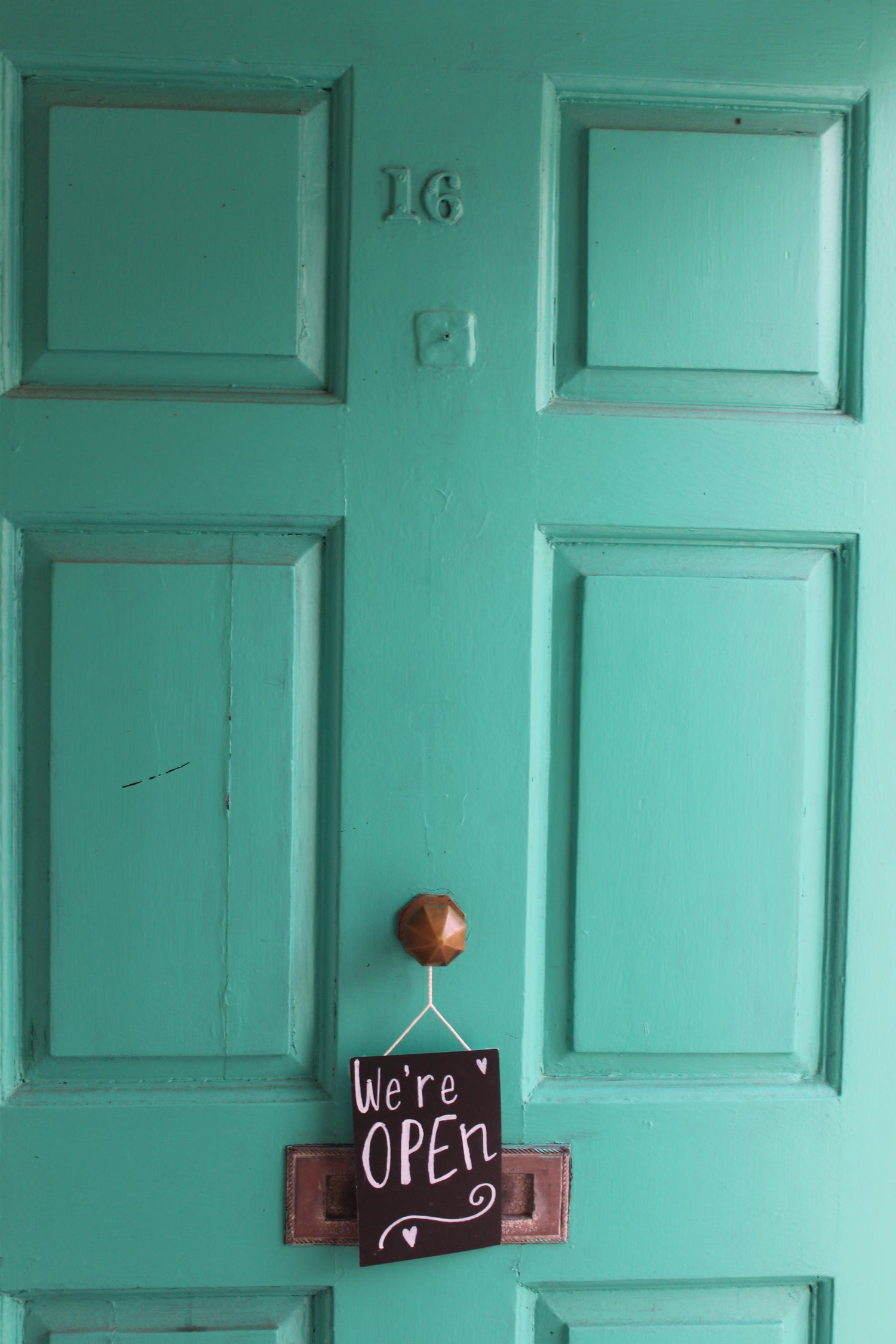 The door of The Magpie Collective with an open sign